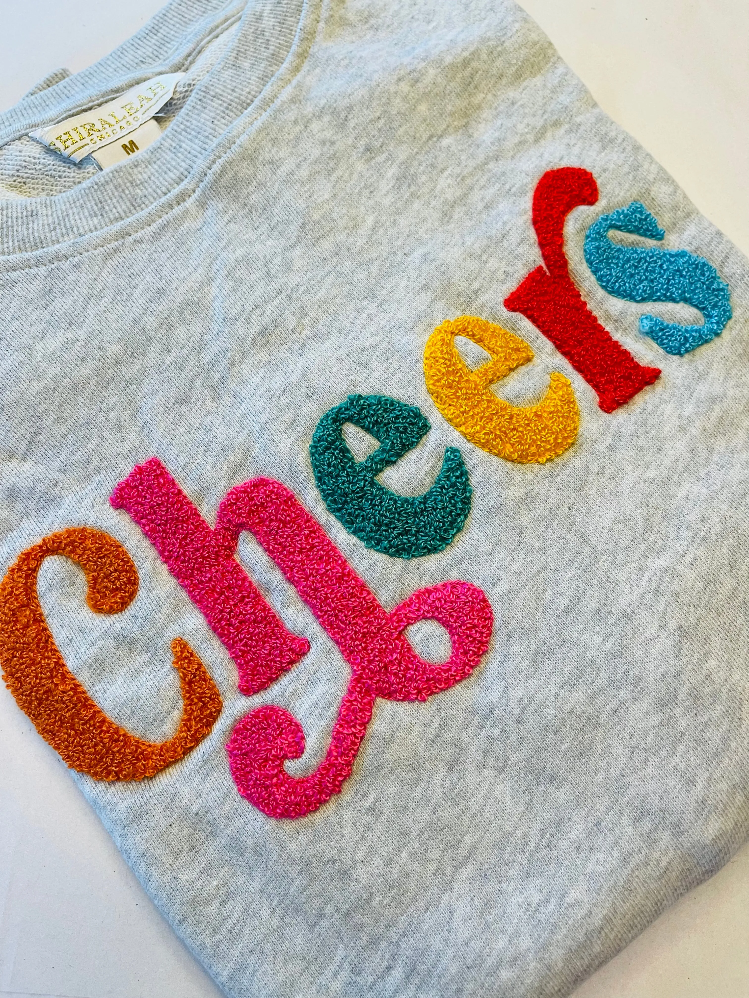 “CHEERS Embellished Crewneck Sweatshirt