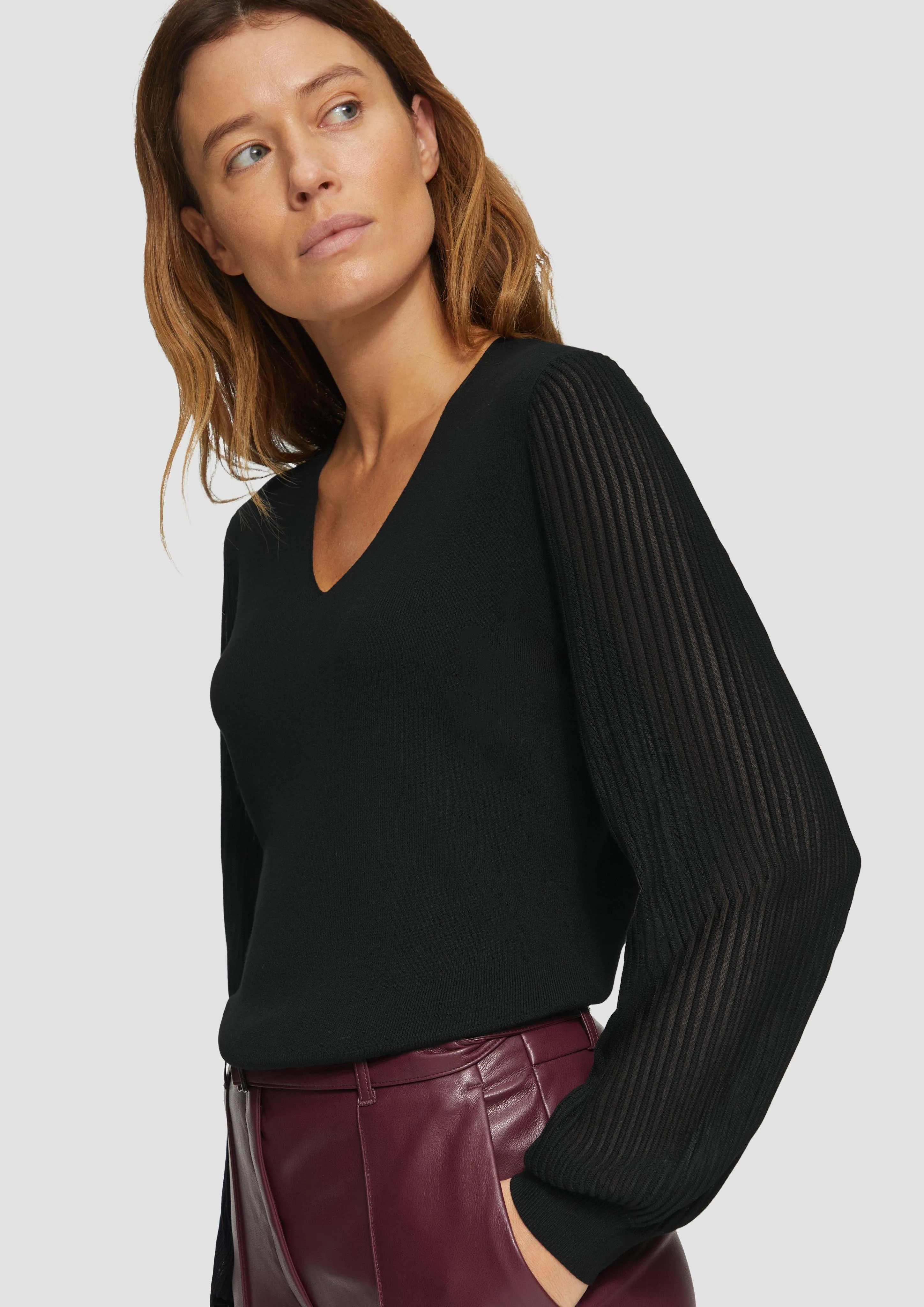 Knitted jumper with semi-sheer sleeves